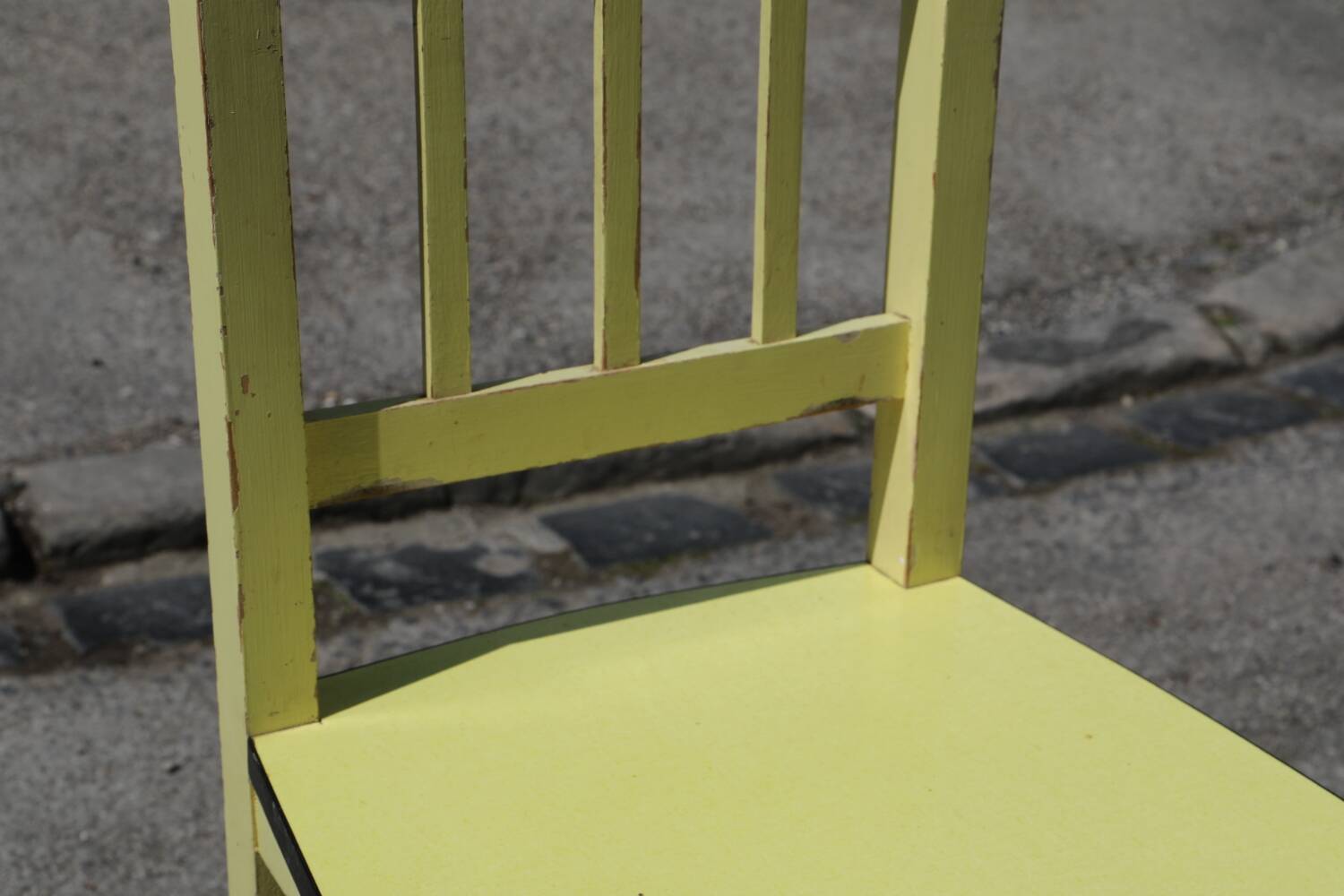 Formica and yellow wood chair