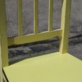Formica and yellow wood chair