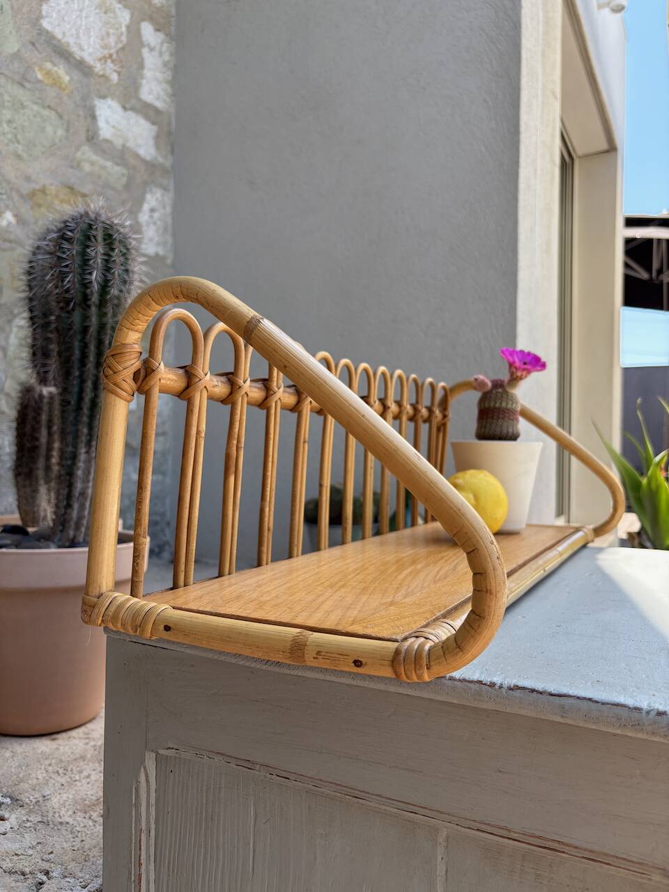 Superb and rare vintage rattan shelf.