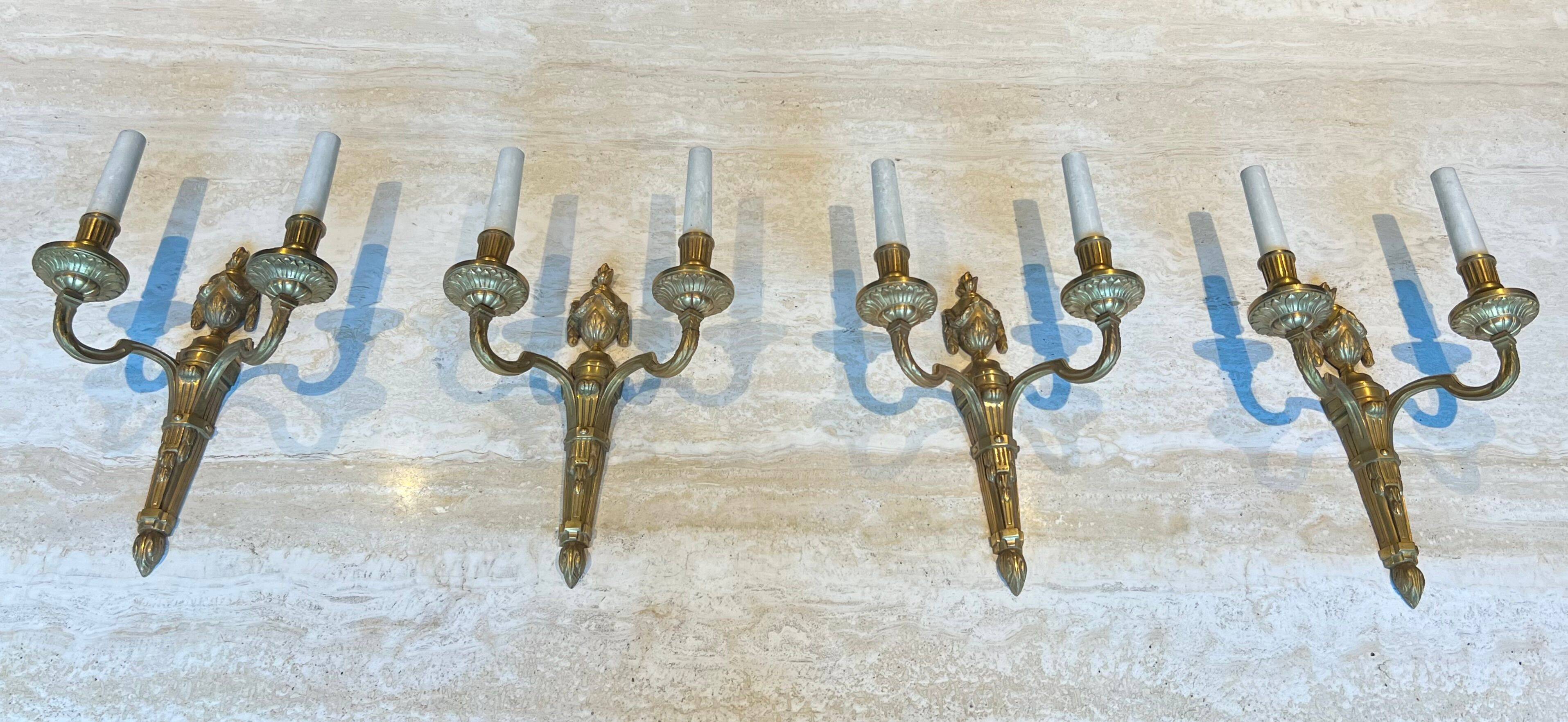 Set of 4 bronze wall lights in Louis XVI style.