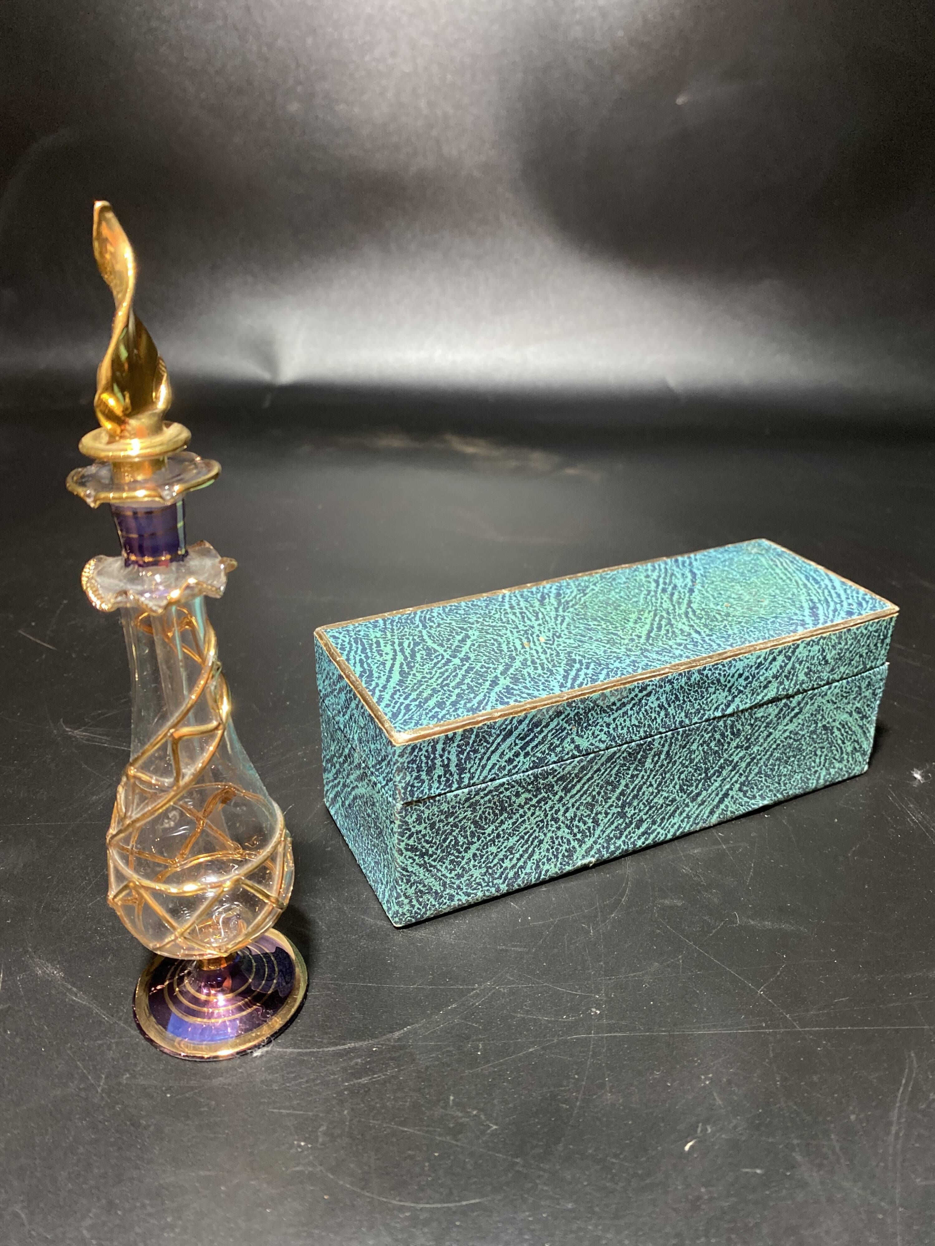 Set of 8 blown glass perfume bottles gilded with 12 carat gold
