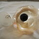 Suspension in a ribbed tulip shape, made of smoked glass.