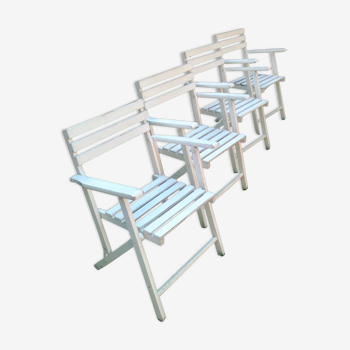 The four foldable wooden chairs