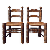 Pair of rustic chairs in the style of Charles Dudouyt.
