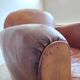 Patinated leather club armchair