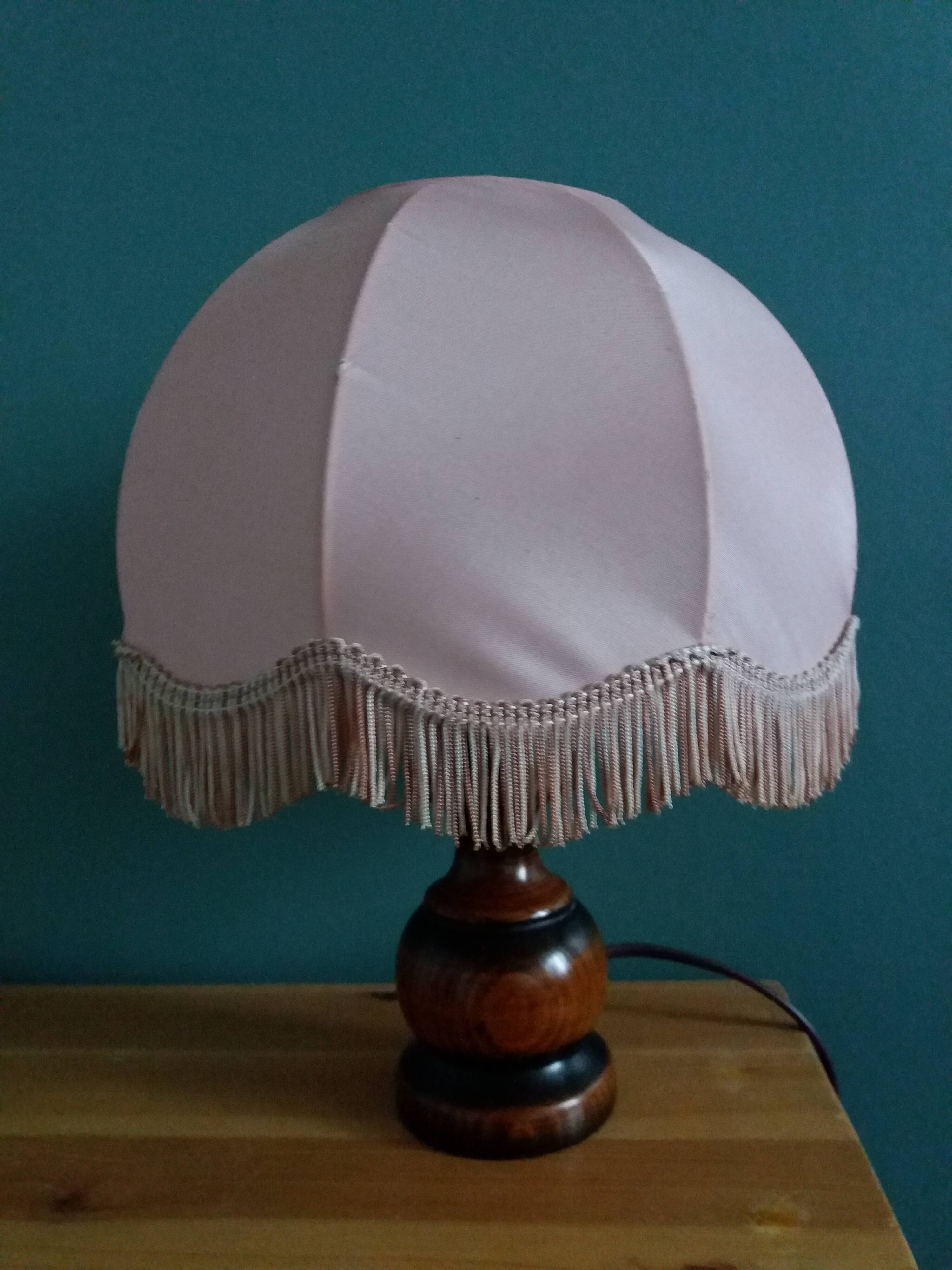 Turned wood bedside lamp with fabric lampshade