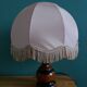 Turned wood bedside lamp with fabric lampshade