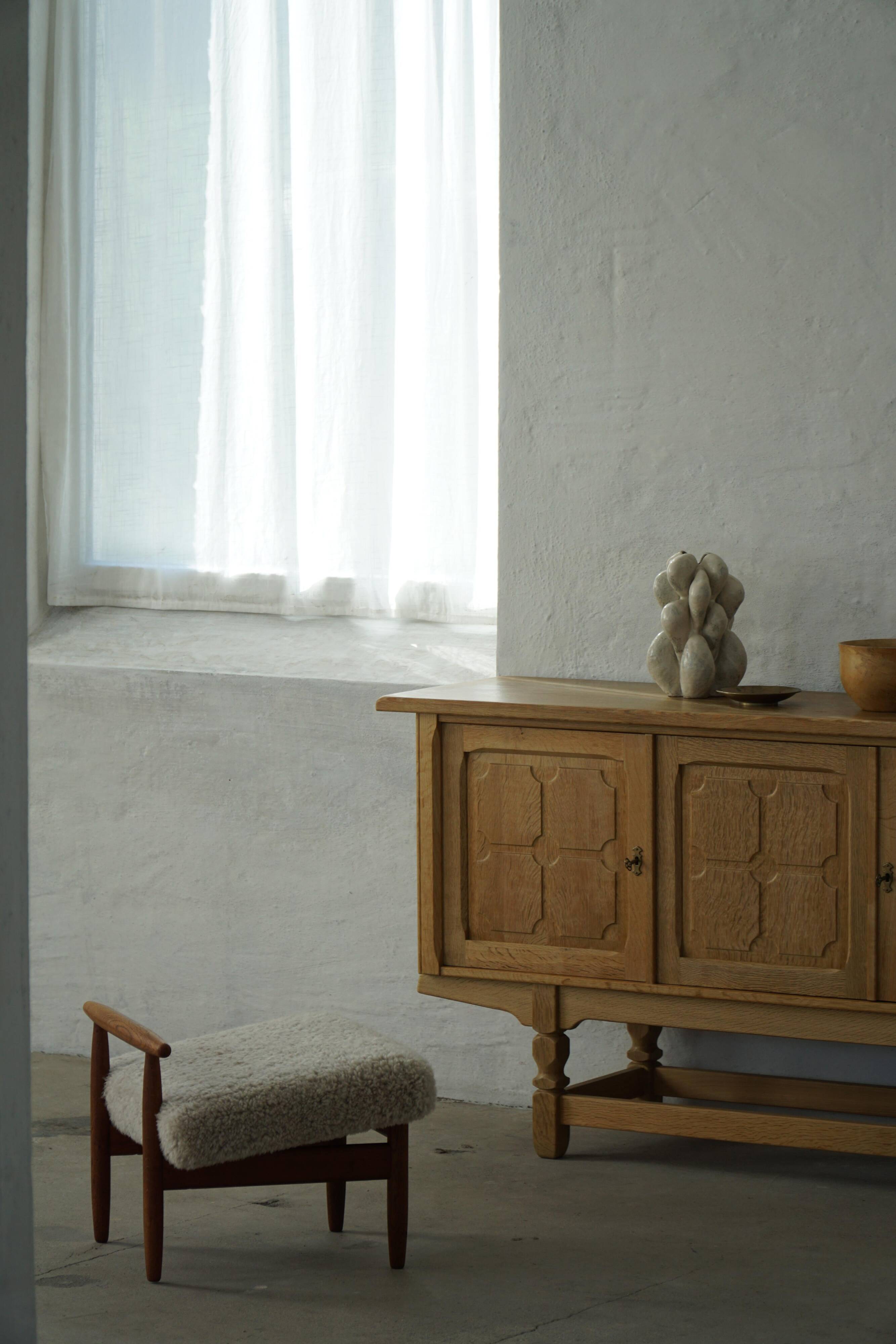 Eivind A. Johansen, oak footrest with light lambswool padding for FDB Møbler
