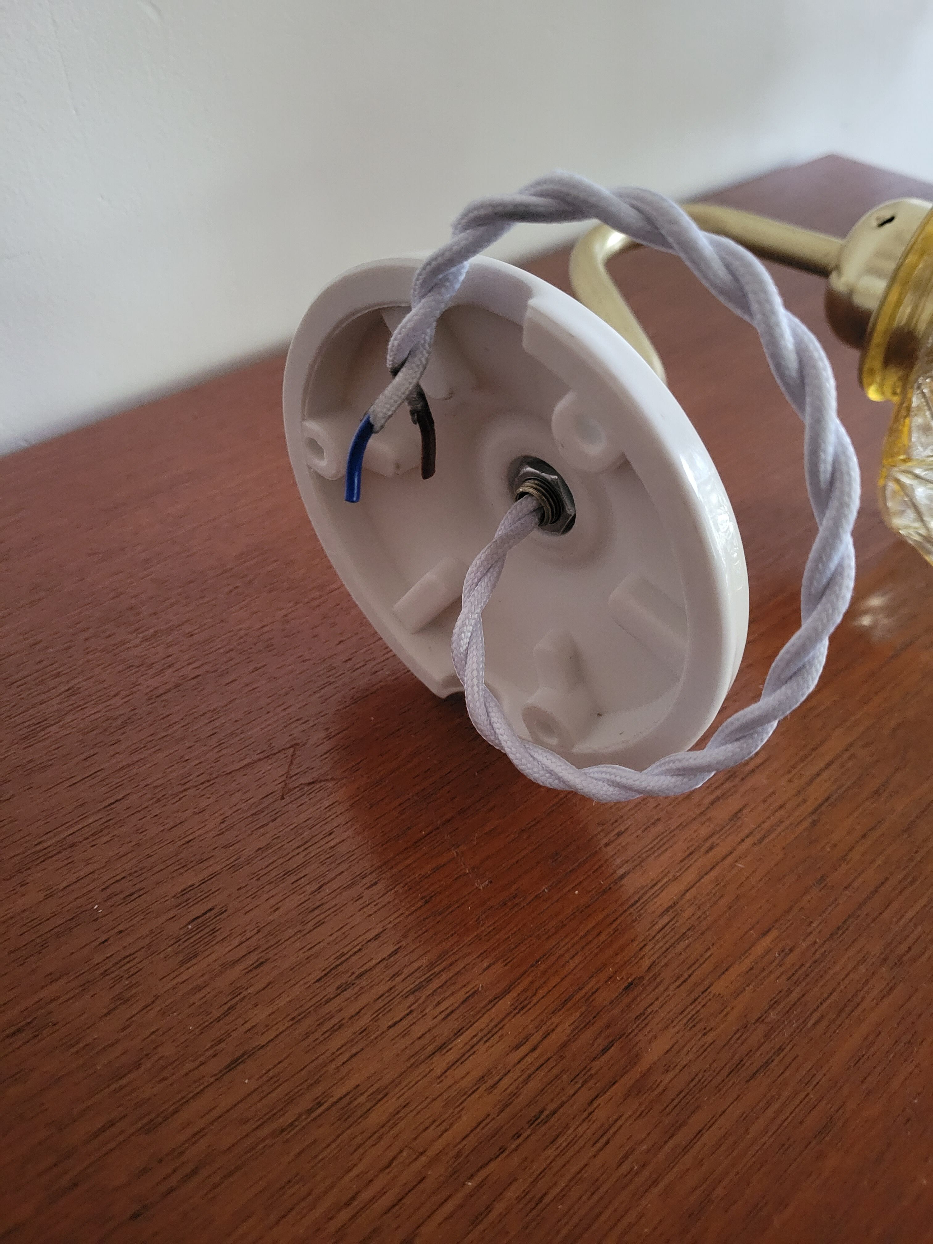 Brass wall lamp and molded glass