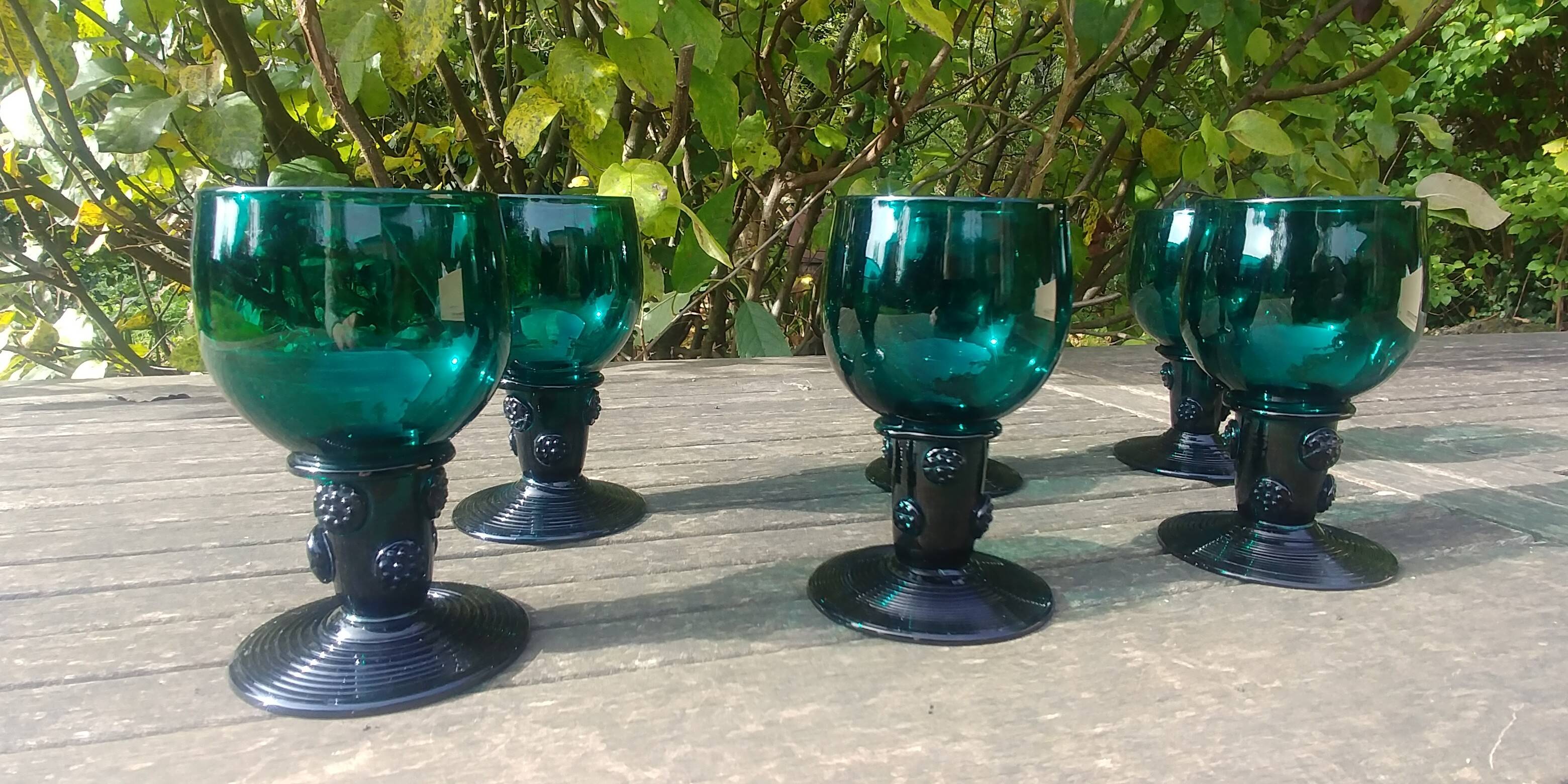 Six Roemer glasses in green blown crystal with "pastilles" decoration