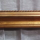 Old frame in wood and gilded stucco