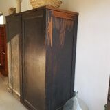 Old black wardrobe - wooden drawers and labels of origin