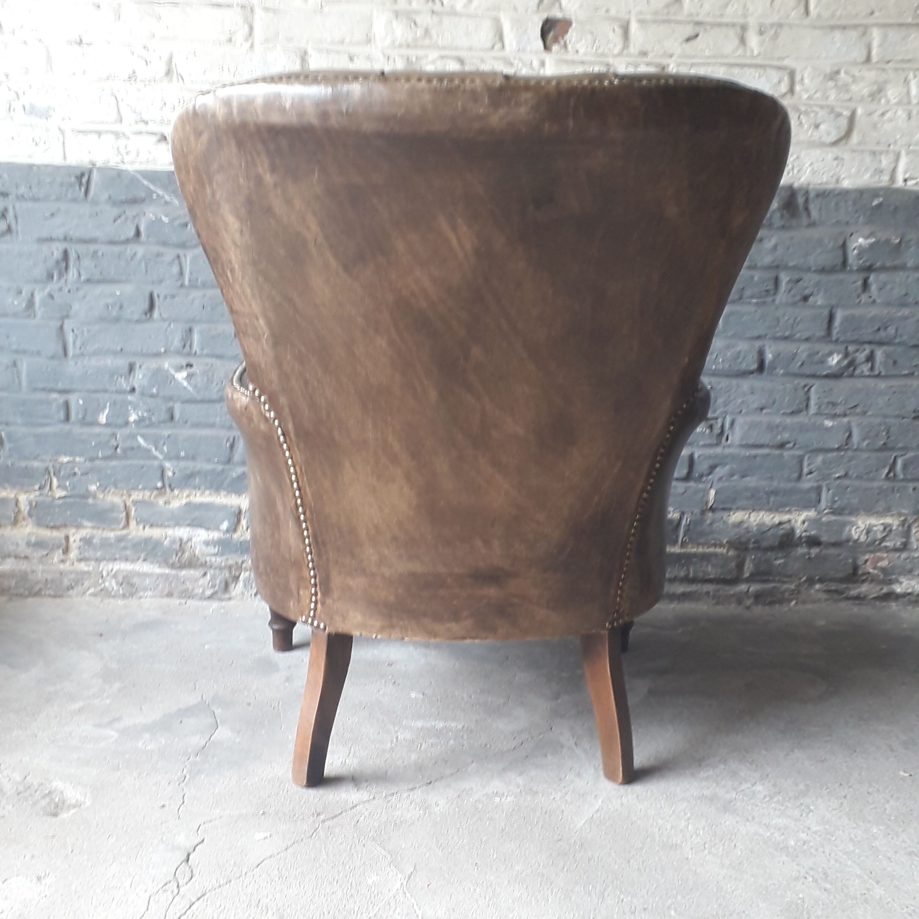 Fauteuil Chesterfield antique