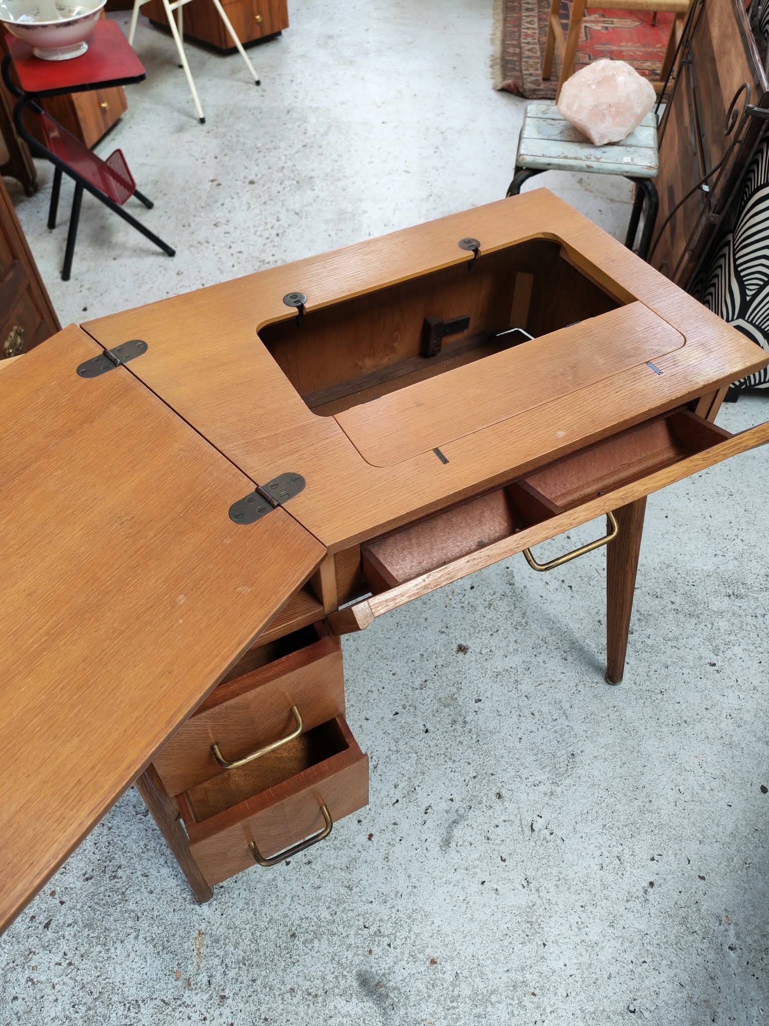 Vintage 1950s side desk with tapered legs.
