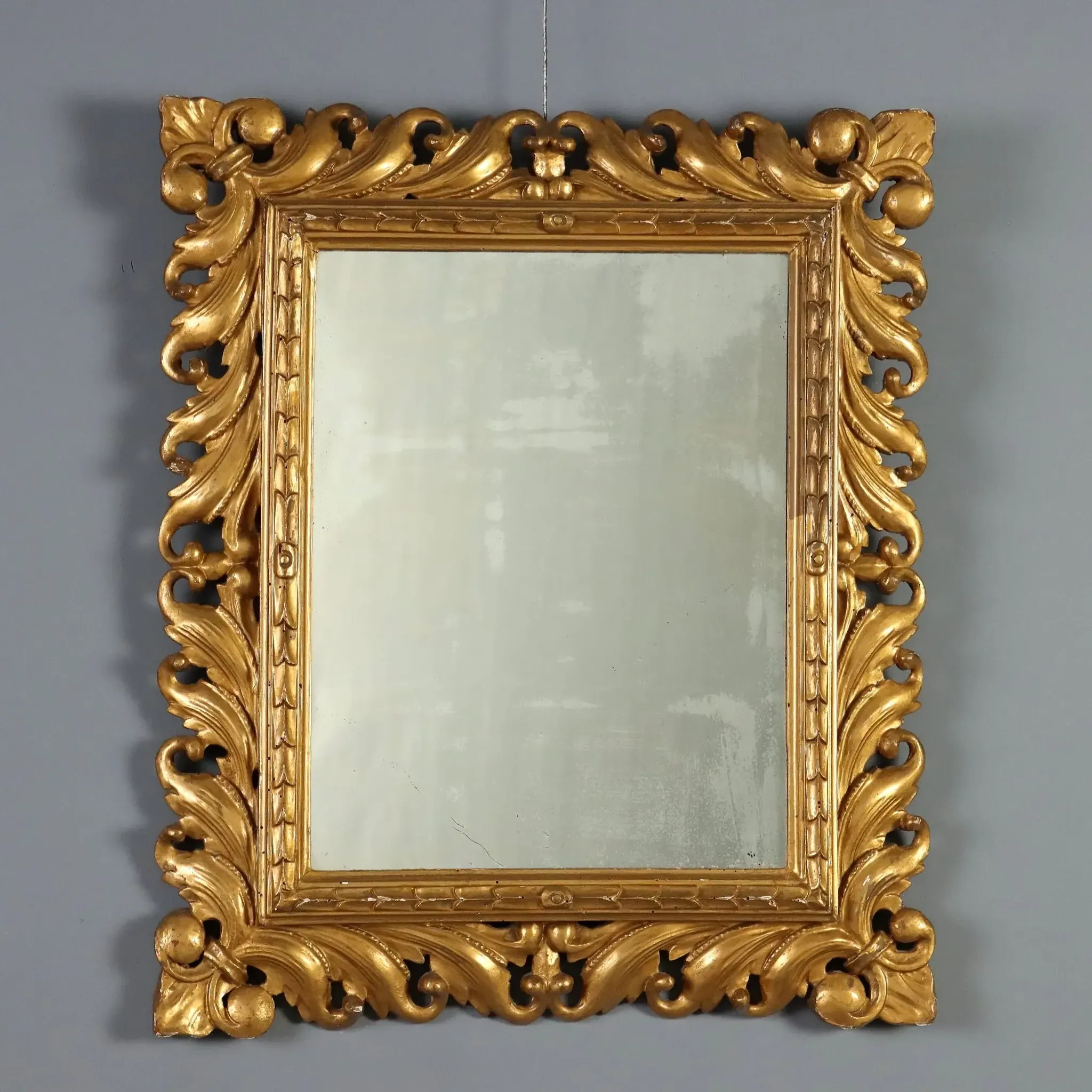 Eclectic antique mirror in carved and gilded wood, Italy, 20th century