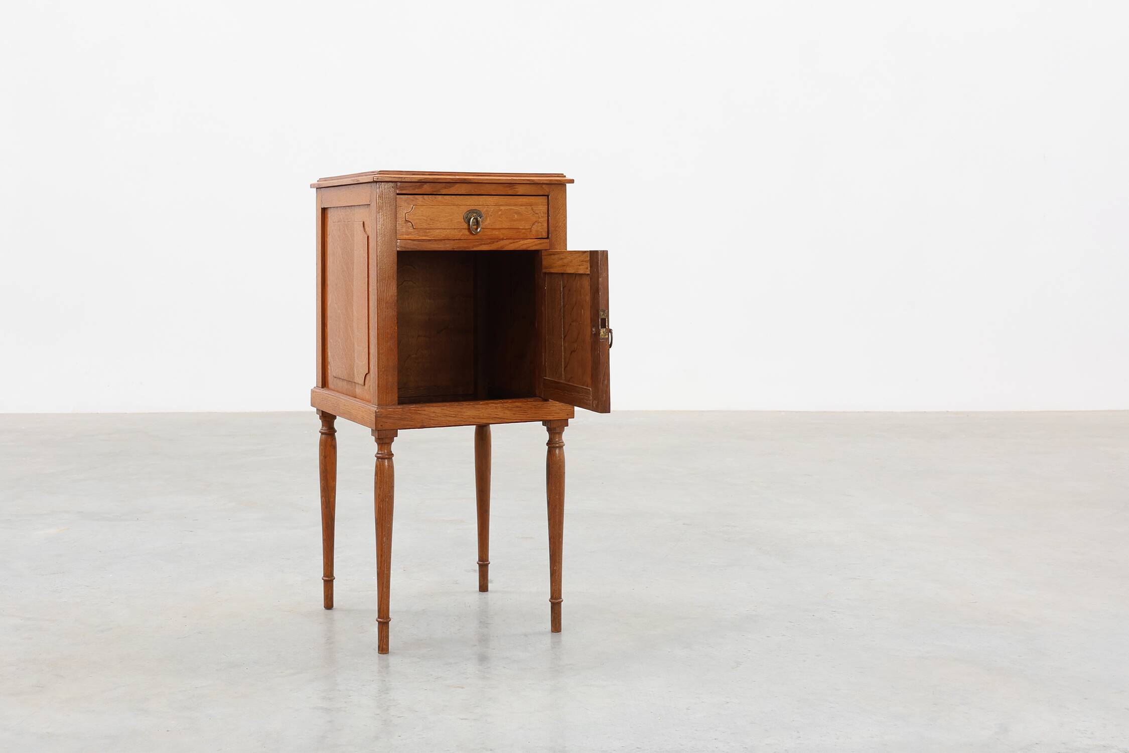 Art Deco nightstand in oak with turned legs, France 1920