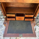 A small piece of Bonheur du jour with detached columns in Empire-era mahogany.