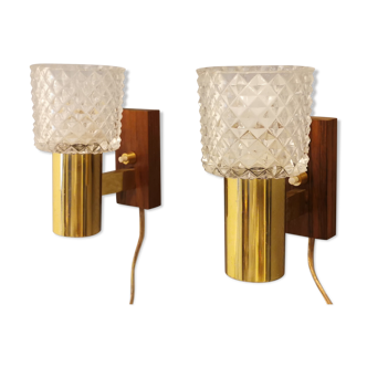 Two smaller wall lamps, made of crystal, rosewood hanging with brass colored details