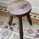 Old dark wood tripod stool