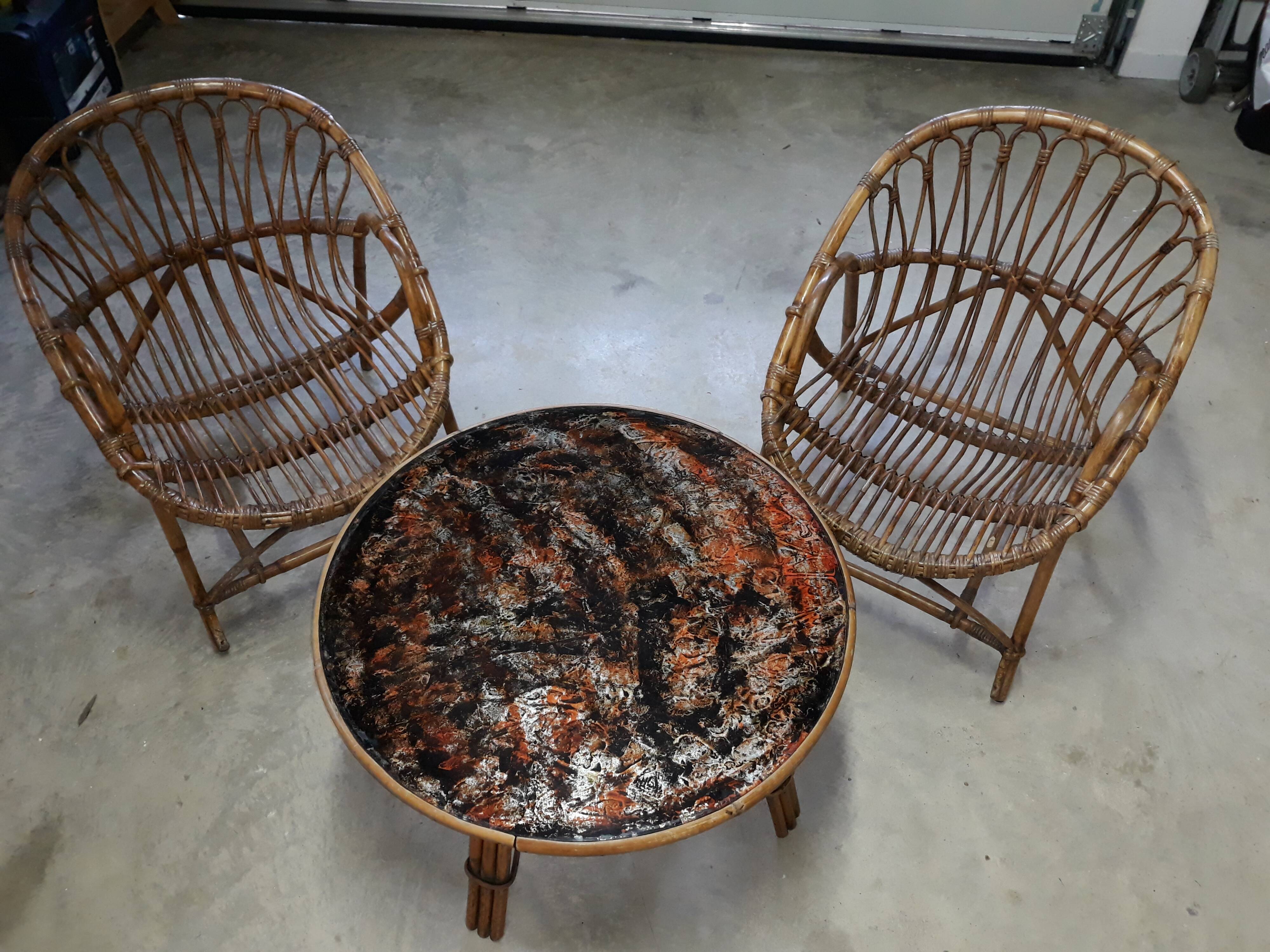 Pair of rattan armchairs and table