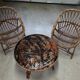 Pair of rattan armchairs and table