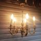Antique gilded bronze chandelier in Louis XVI style, 5 lights, in working condition.