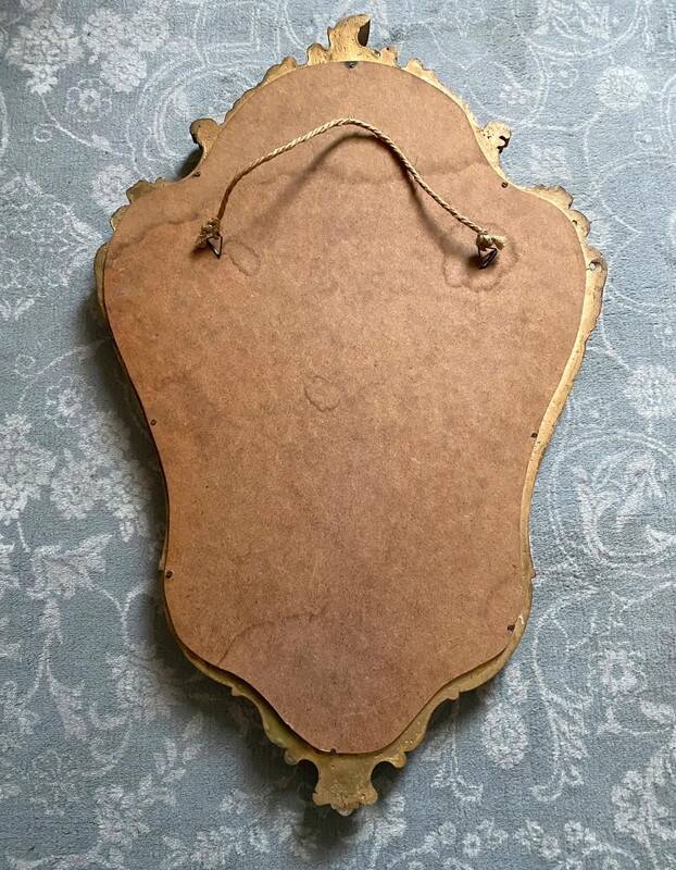 Old golden mirror in composite resin baroque style 60s