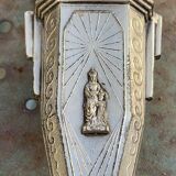 Pair of metal candlesticks, chiseled with a statuette in front, rose pattern in relief, art deco