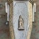 Pair of metal candlesticks, chiseled with a statuette in front, rose pattern in relief, art deco