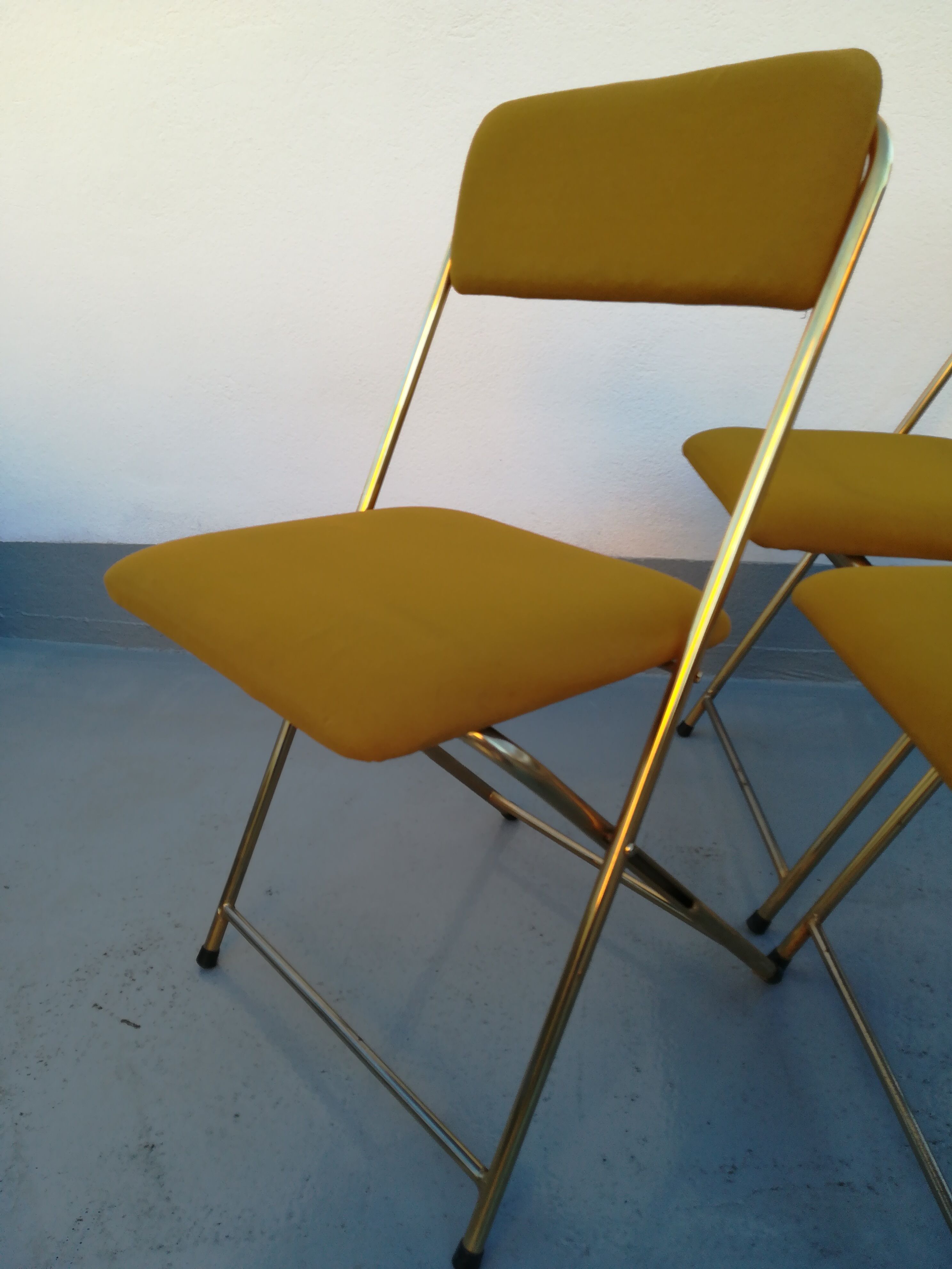 4 folding gold vintage Eyrel chairs
