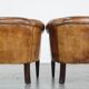 Set of 2 subtle, stately and sturdy club chairs made of sheepskin