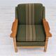 Fauteuil en laine verte et bois de chêne