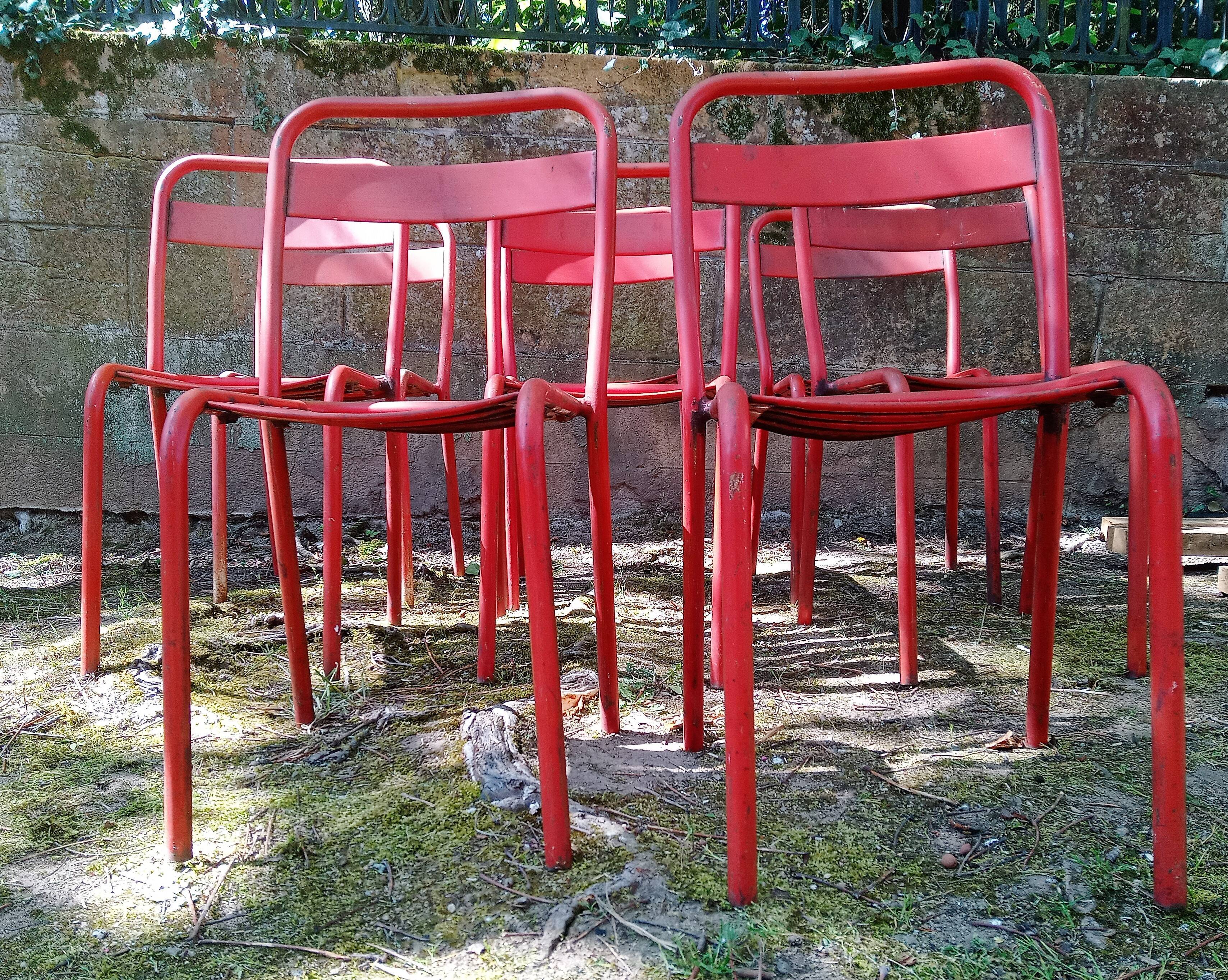 Series of 8 red Tolix chairs