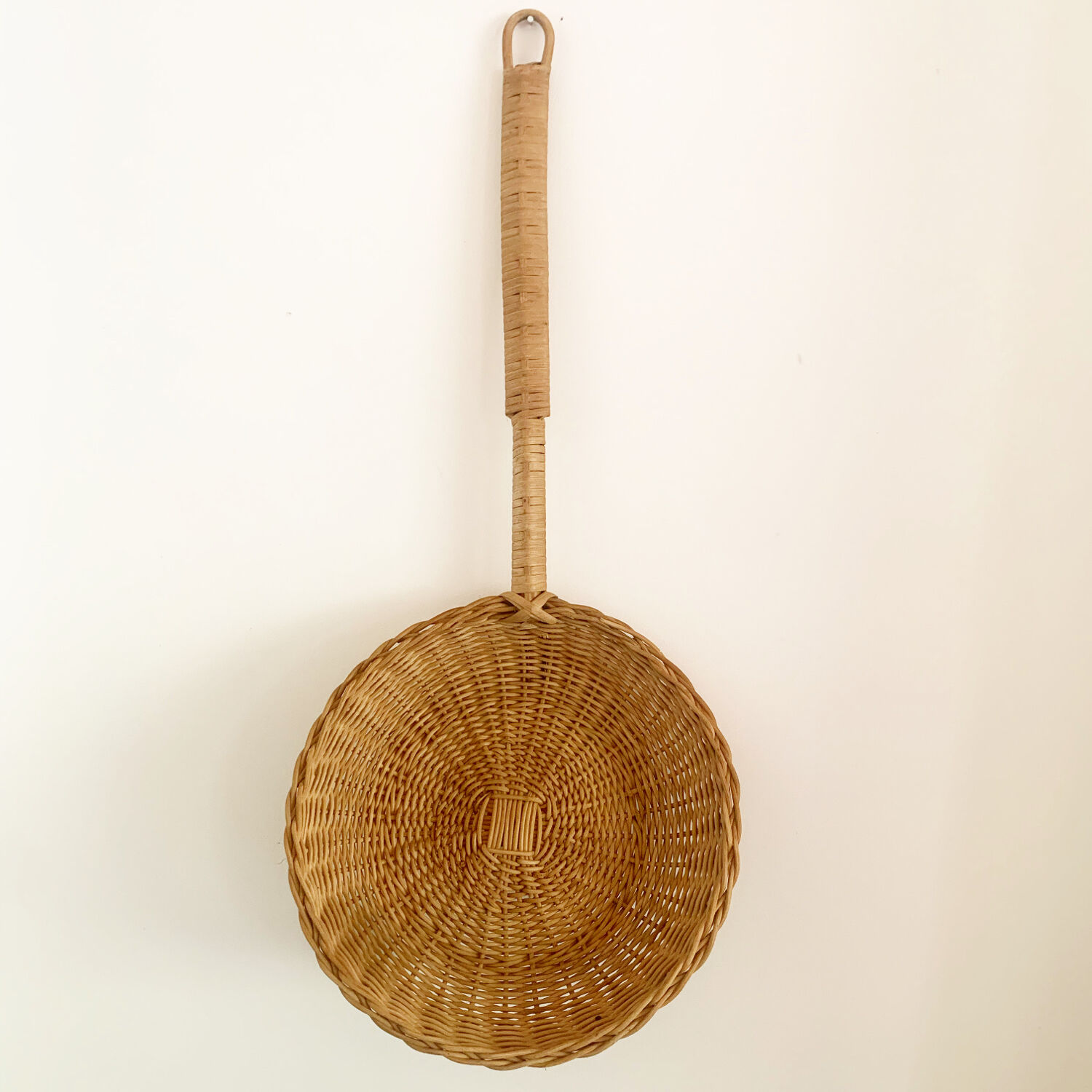 Long-handled wicker basket