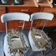 Pair of mirror wall sconces with brass candle holders.