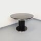 Vintage dining table in melamine with a black wood effect and chrome metal.
