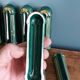 Poët Laval knife rest in emerald green ceramic and gold.