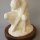 Sculpture of a seated man. Classical male sculpture. Male figure.