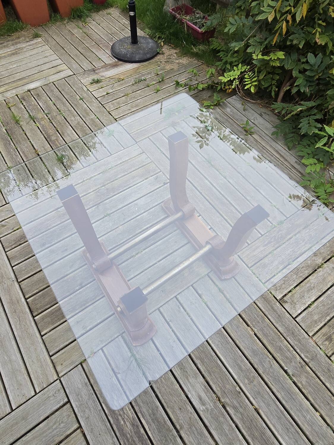 Art Deco coffee table in glass, wood, and brass.
