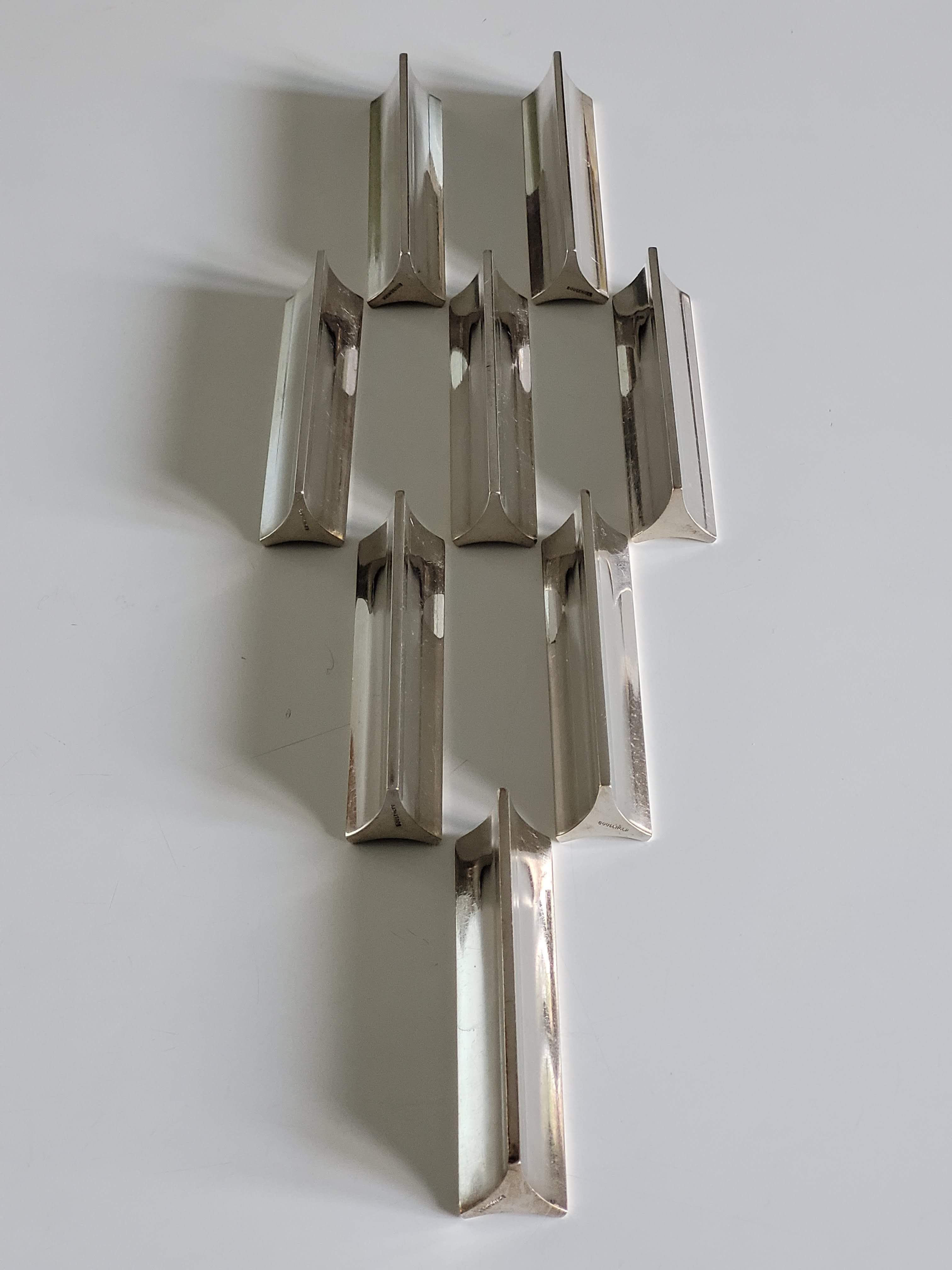 Eight Boulenger knife holders in art deco silver metal