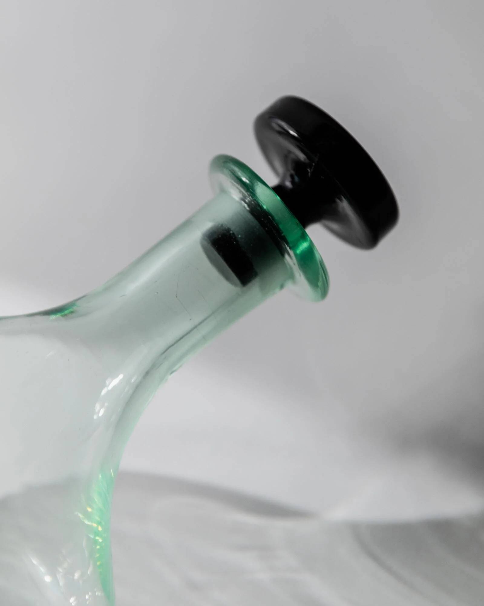 Vintage Murano glass carafe from the 1960s, green and black, with a stopper.