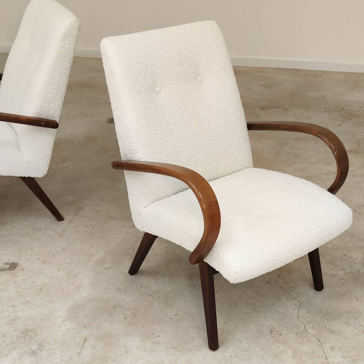 Pair of Jaroslav Smidek armchairs for Ton Bystrice, restored with white boucle, 1960.