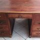 Vintage double-sided mahogany desk with 18 drawers.