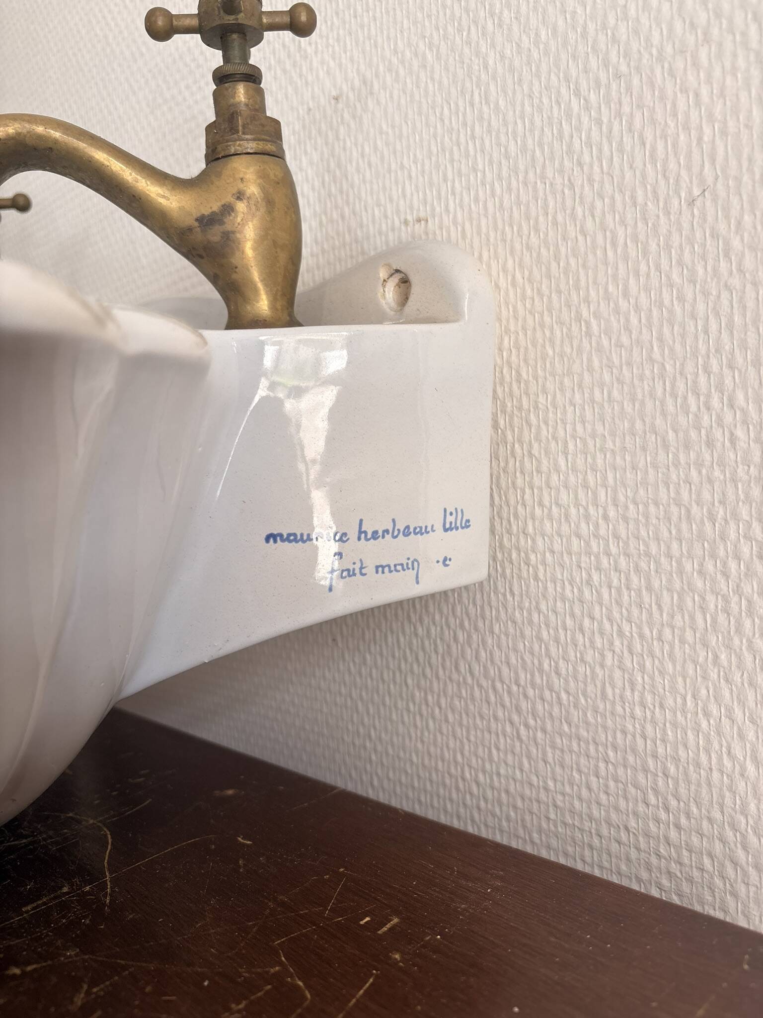 Wall-mounted washbasin shell-shaped, enamelled earthenware by Maurice Herb.