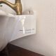 Wall-mounted washbasin shell-shaped, enamelled earthenware by Maurice Herb.
