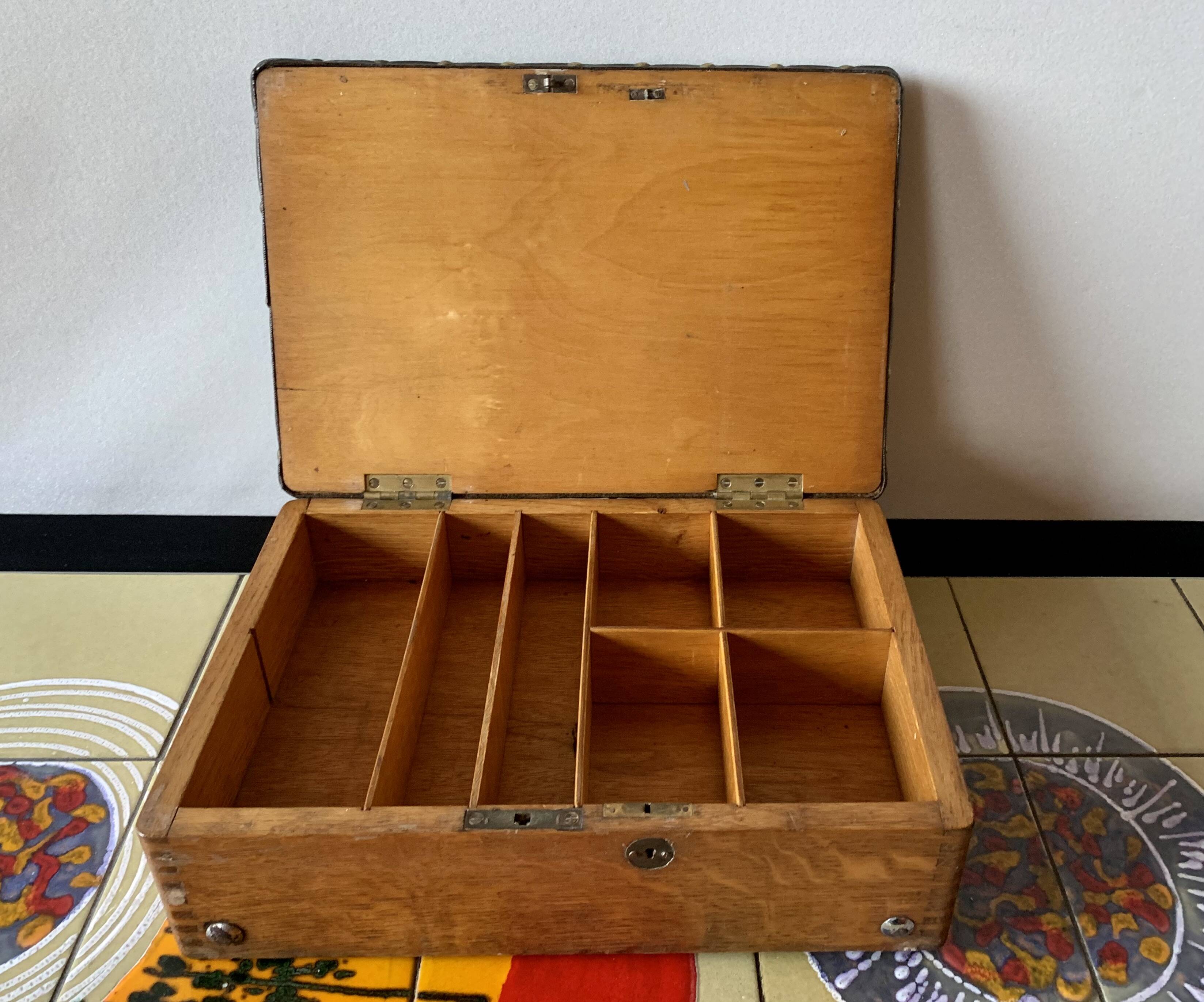 Old foldable fisherman's stool in wood and leather