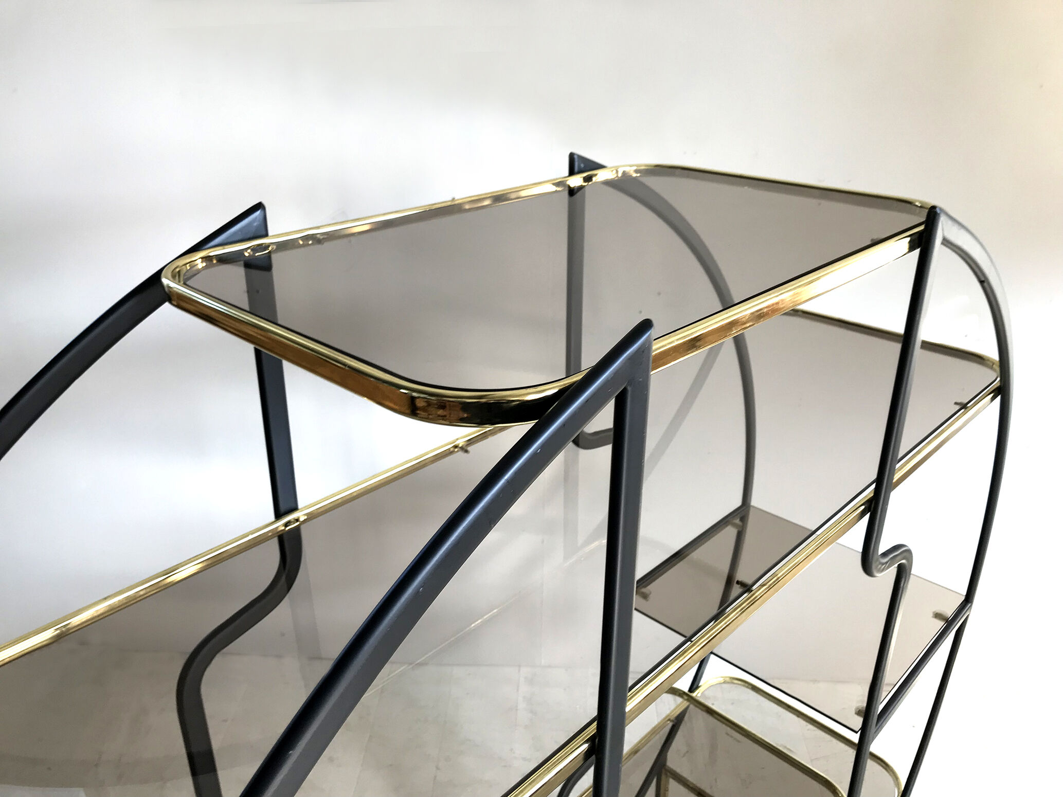 "Circle" library in black anodized metal and golden brass, 1970
