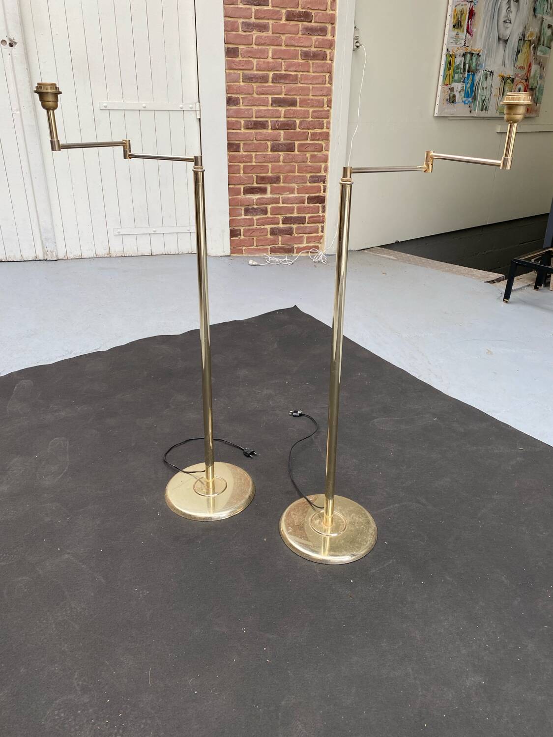Pair of articulated floor lamps
