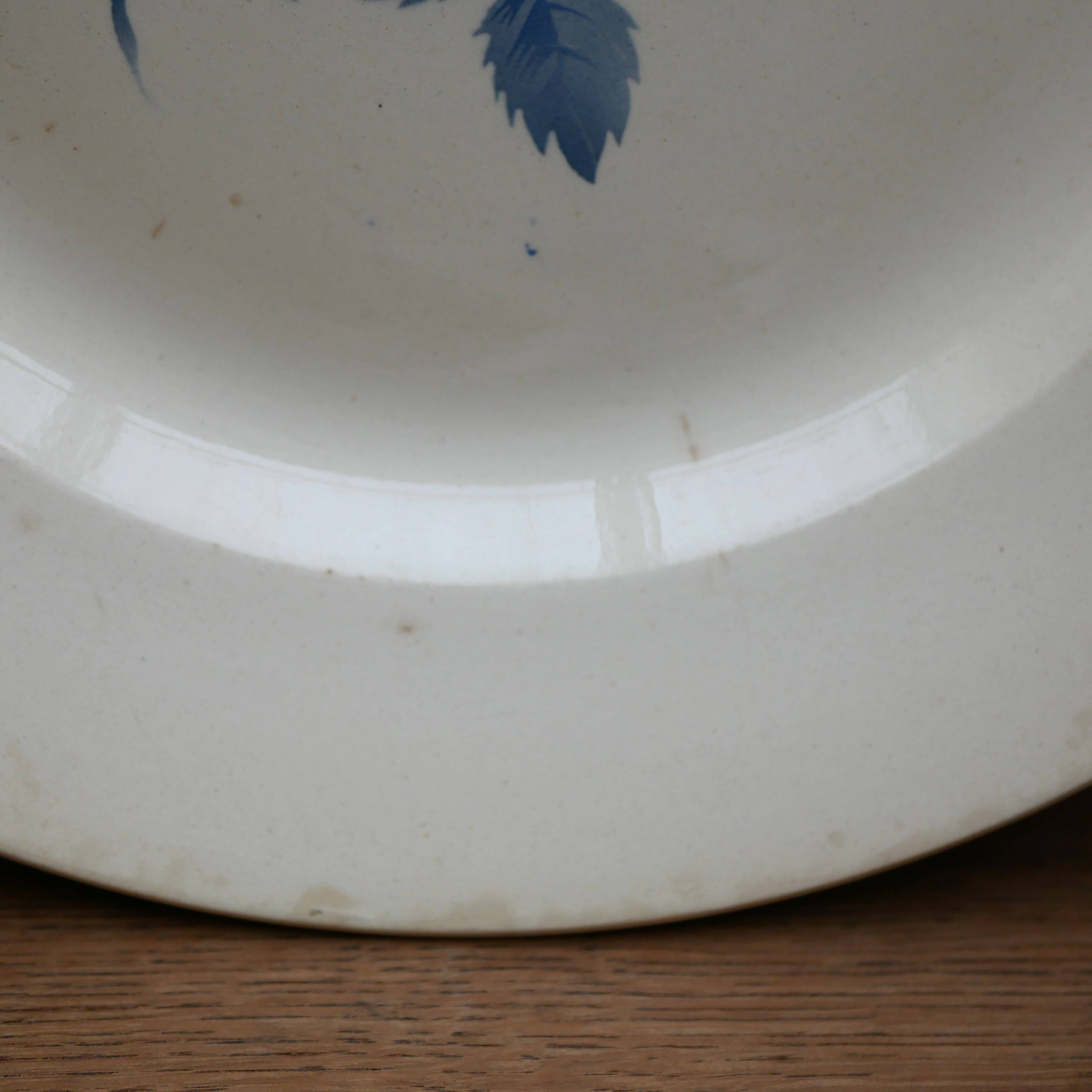 Large round stoneware serving platter from Digoin with a blue rose motif