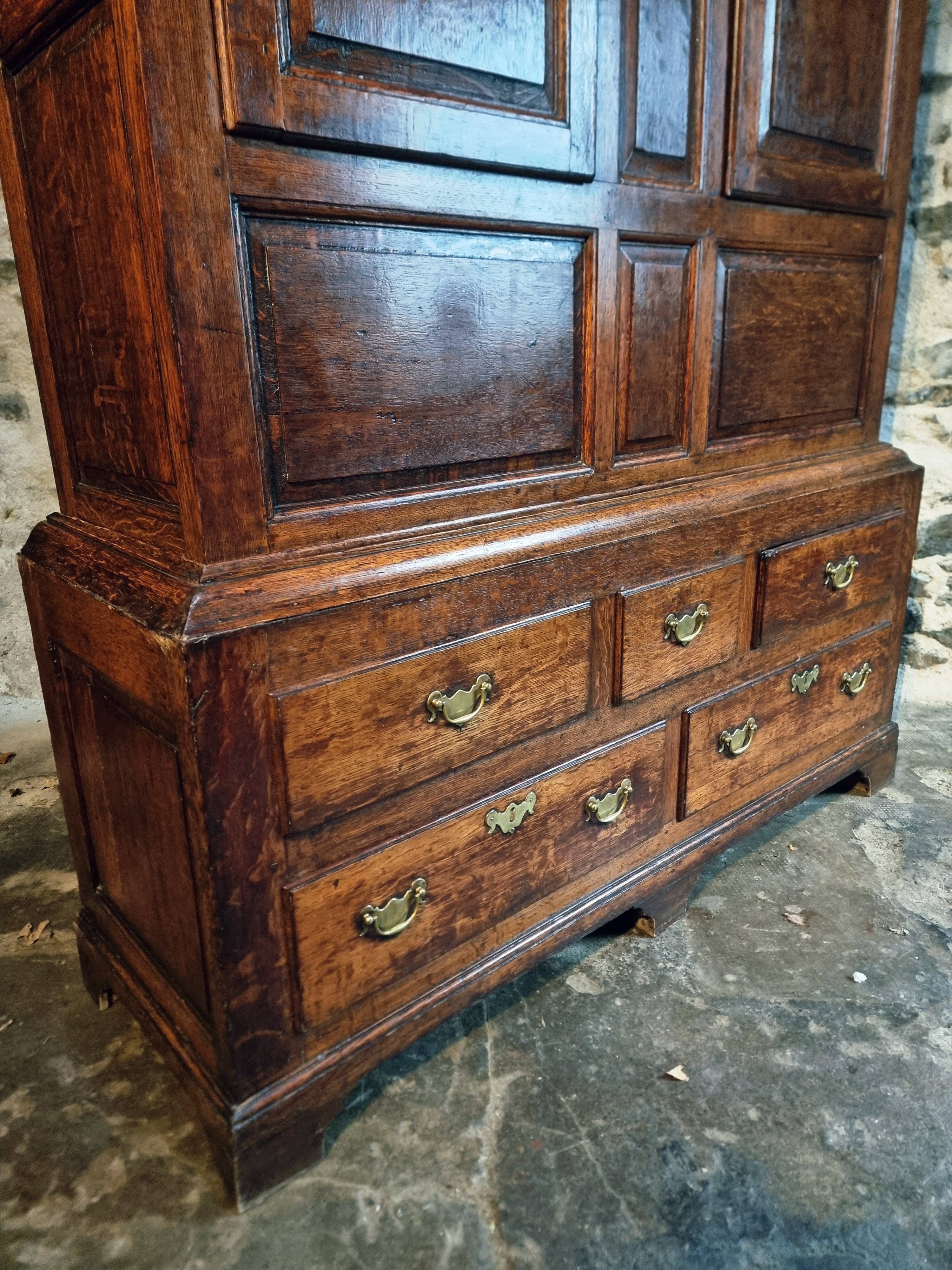 Antique English oak wardrobe with drawers, England, circa 1800–1820.